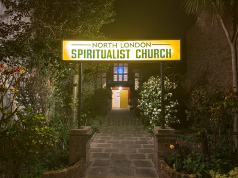 Entrance sign at night
